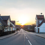 asphalt road leading to sunset in scottish village
