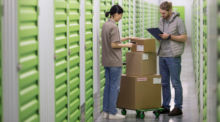 couple with cardboard boxes in storage in Glasgow